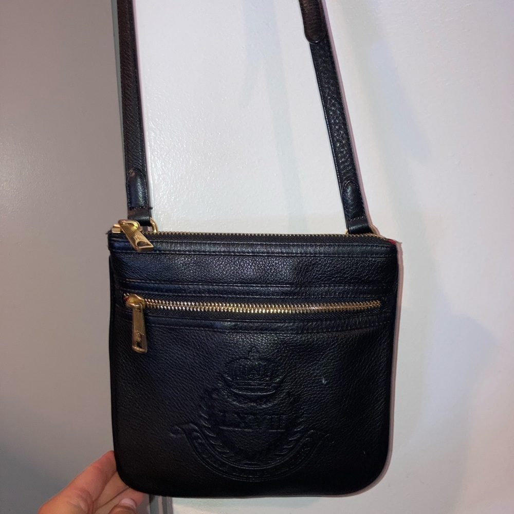 Black crossbody bag. Great condition. Red inside makes things super easy to find